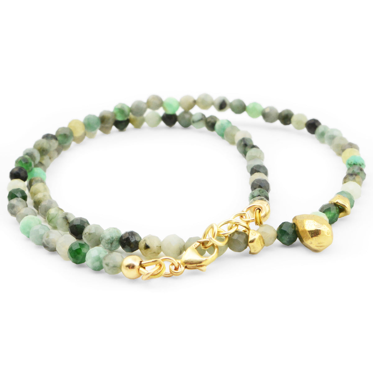 Angled view of Teardrop Emerald Necklace showcasing faceted green emerald beads and gold-filled clasp on a white background