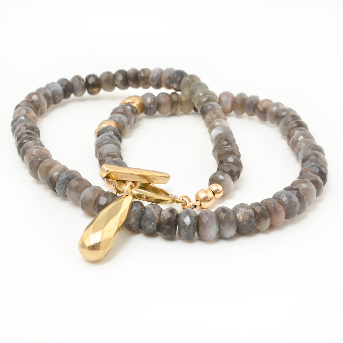 Close-up of Golden Teardrop Moonstone Necklace with faceted labradorite beads, golden bronze clasp, and teardrop pendant