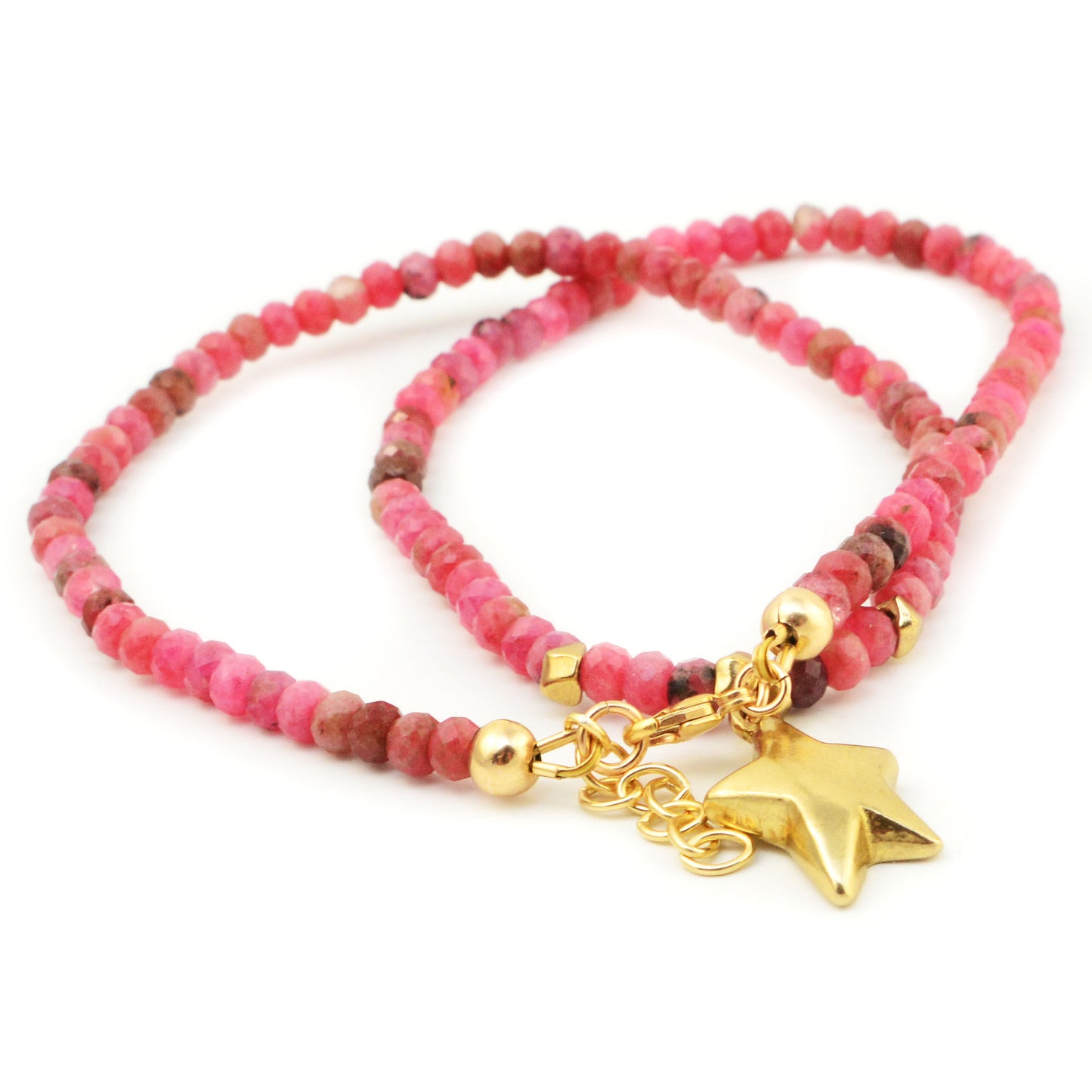 Close-up of Golden Shine Necklace showcasing pink rhodonite beads and golden bronze star pendant on a white background